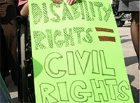 a protestor sign that reads disability rights are civil rights